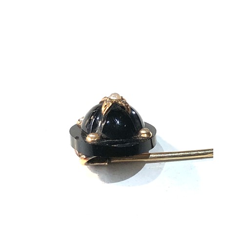 291 - Antique 9ct gold onyx & seed-pearl pin measures approx 8cmlong head diameter 1.4cm