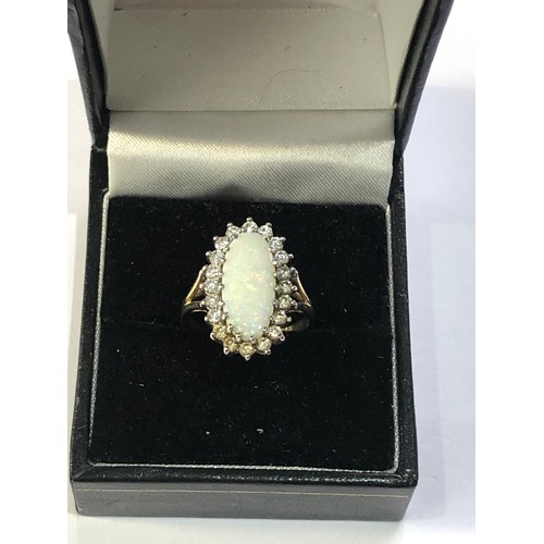 118 - 9ct gold opal halo ring weight 3.2g