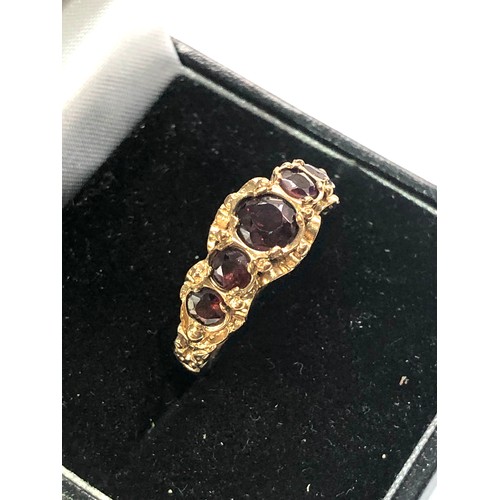 297 - 9ct gold garnet 5 stone ring weight 3.1g