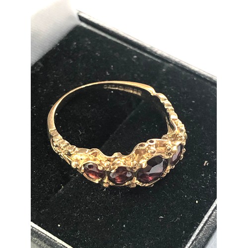 297 - 9ct gold garnet 5 stone ring weight 3.1g