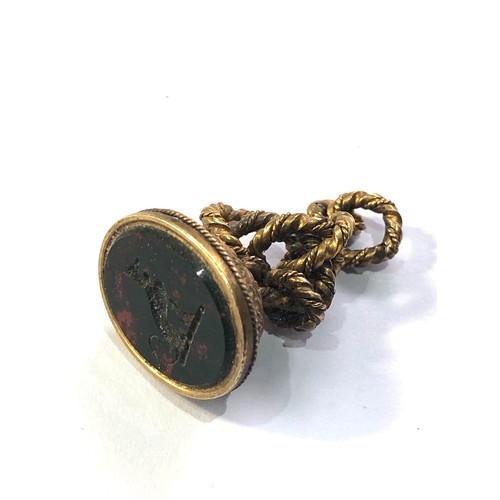 111 - High carat gold antique dog intaglio fob seal measures approx 2.7cm drop weight 4.7g xrt tested as 1... 