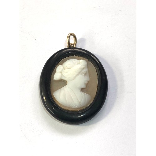 98 - Antique jet hard stone cameo pendant measures approx 2.7cm by 2.2cm damage as shown