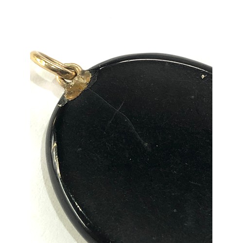 98 - Antique jet hard stone cameo pendant measures approx 2.7cm by 2.2cm damage as shown