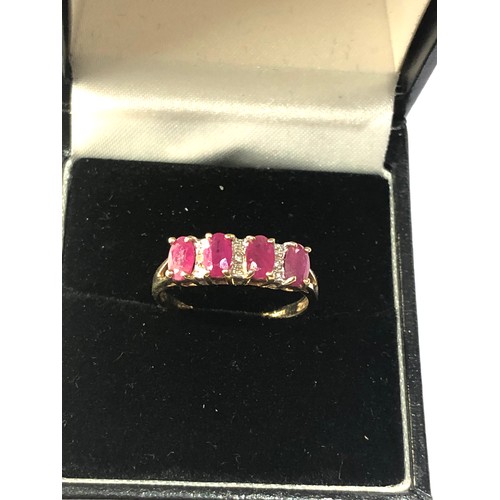 296 - 9ct gold ruby diamond accent ring weight 2g