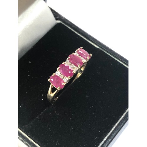 296 - 9ct gold ruby diamond accent ring weight 2g