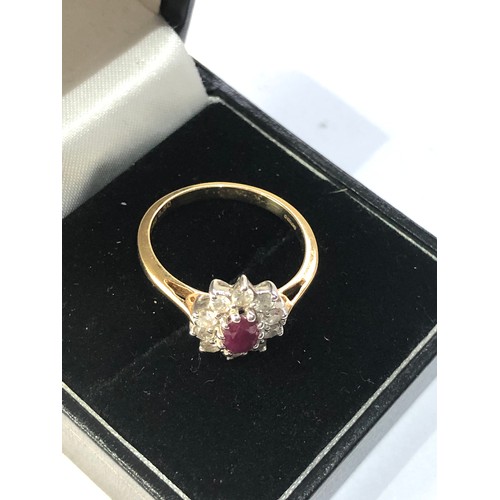 168 - 18ct gold ruby and diamond halo ring weight 3.7g, overall good condition,  marked G750 0.50