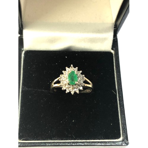 275 - 9ct gold emerald halo ring weight 1.7g