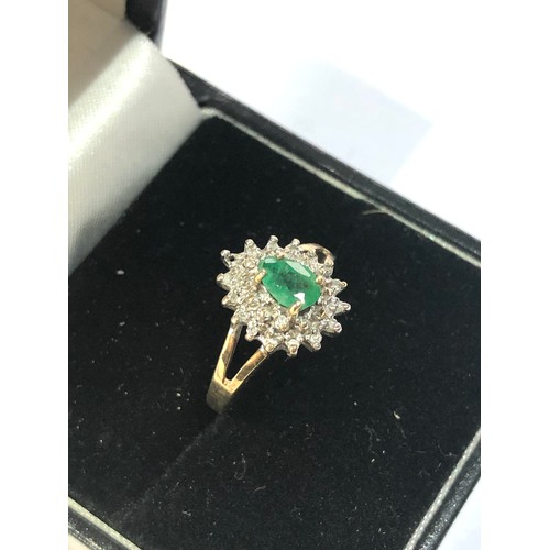 275 - 9ct gold emerald halo ring weight 1.7g