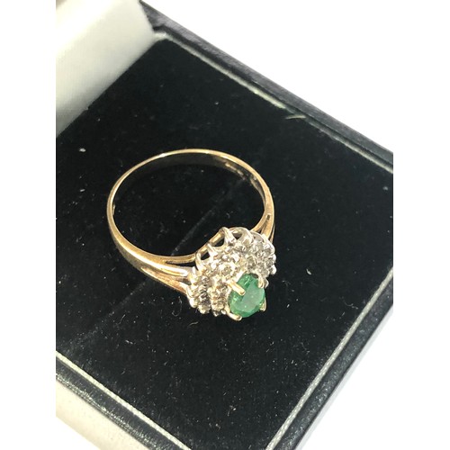 275 - 9ct gold emerald halo ring weight 1.7g