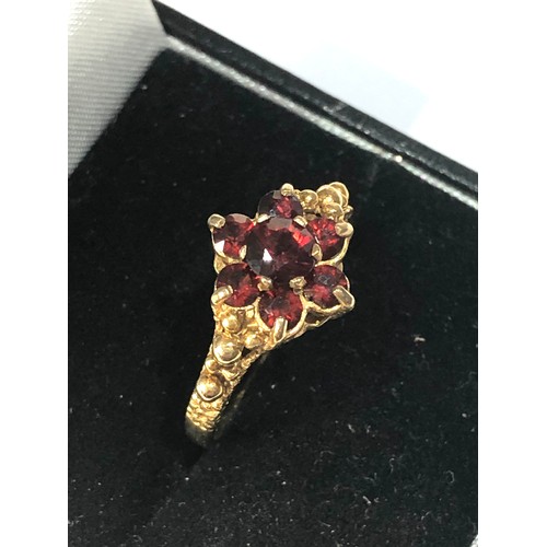 295 - 9ct gold garnet cluster ring weight 2.7g