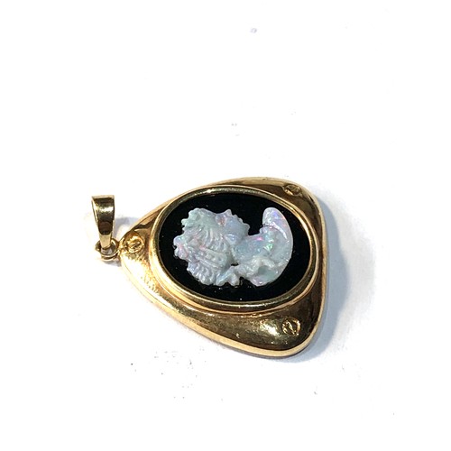 143 - 14ct gold opal and onyx cameo pendant measures aprox 2.5cm drop by 2cm wide weight 3g