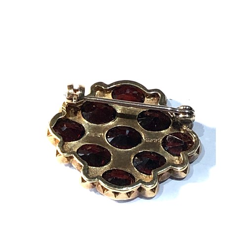 317 - 9ct gold garnet and pearl brooch 1 pearl replaced and glued weight 6.2g