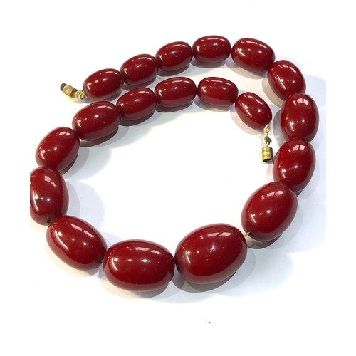 288 - Cherry bakelite amber necklace 86g no internal streaking largest bead measures appox 29mm by 22mm