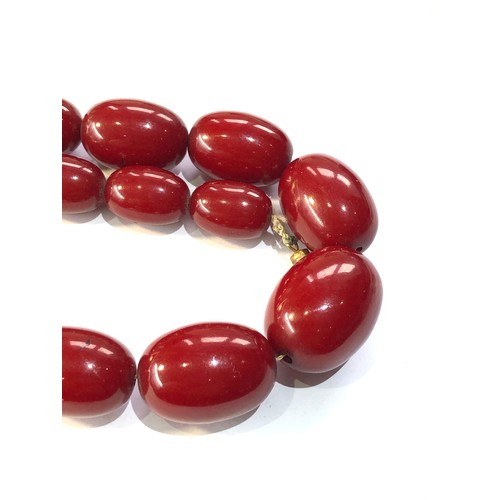 288 - Cherry bakelite amber necklace 86g no internal streaking largest bead measures appox 29mm by 22mm