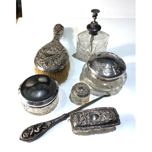 56 - Silver dressing table items includes brush silver top jars etc
