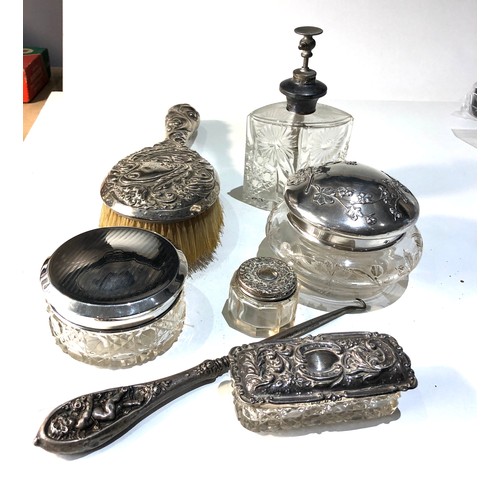 56 - Silver dressing table items includes brush silver top jars etc