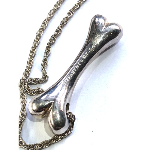 377 - Tiffany & Co silver dog bone pendant and chain