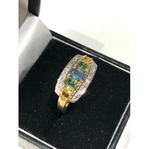 83 - 9ct gold diamond and gem set ring size n weight 4.3g