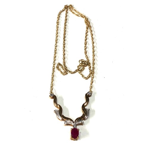 86 - 9ct gold diamond and ruby pendant necklace weight 3.8g