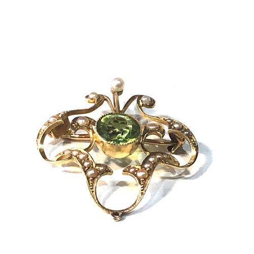 85 - Antique 15ct gold peridot and seed-pearl pendant / brooch measures approx 3.4cm drop by 3cm wide wei... 