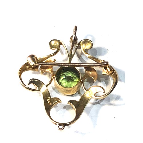 85 - Antique 15ct gold peridot and seed-pearl pendant / brooch measures approx 3.4cm drop by 3cm wide wei... 