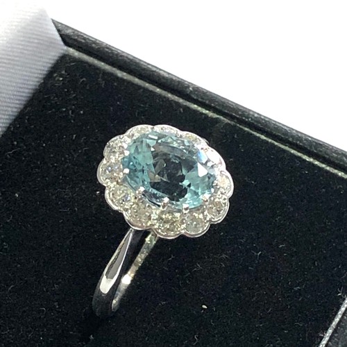 94 - Fine Diamond and aquamarine ring central aquamarine 2ct with a halo of diamonds around hallmarked 18... 