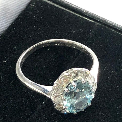 94 - Fine Diamond and aquamarine ring central aquamarine 2ct with a halo of diamonds around hallmarked 18... 