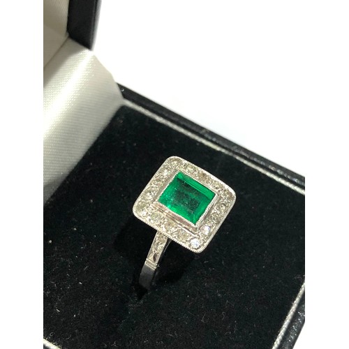 95 - Fine Diamond and Emerald  ring central emerald 0.85ct  with a halo of diamonds around hallmarked pla... 