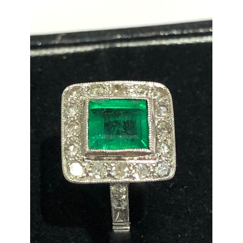 95 - Fine Diamond and Emerald  ring central emerald 0.85ct  with a halo of diamonds around hallmarked pla... 
