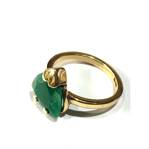 103 - Fine 18ct gold emerald ring large central emerald measures approx 12mm by 11mm weight of ring 4.1g