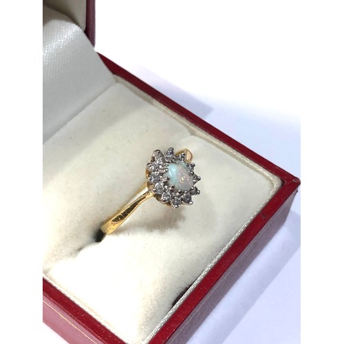 112 - 18ct gold opal and diamond halo ring weight 2.9g