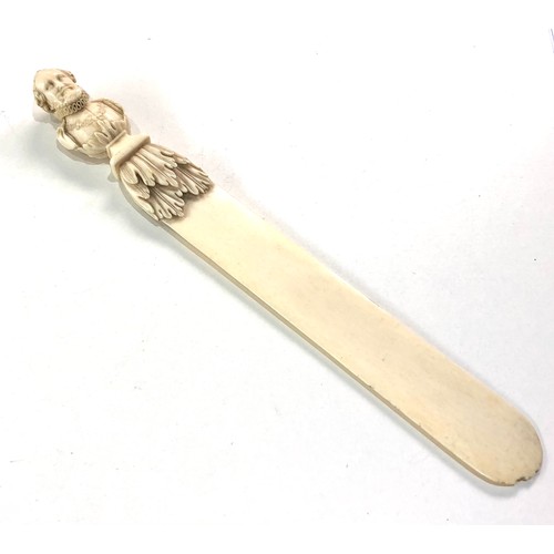 563 - Antique ivory figural top letter opener measures approx 27.5cm long