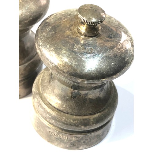 51 - 2 silver hallmarked pepper mills measures approx height 7cm