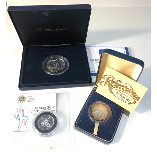 579 - 3 silver proof coins includes referendum 1975 poppy coin and the london 2012 sports