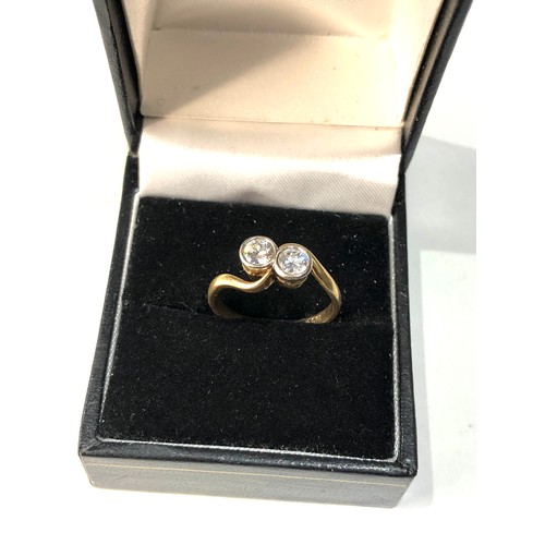 103 - Fine 18ct gold and diamond ring set with 2 diamonds est approx 0.90ct  weight of ring 3.2g