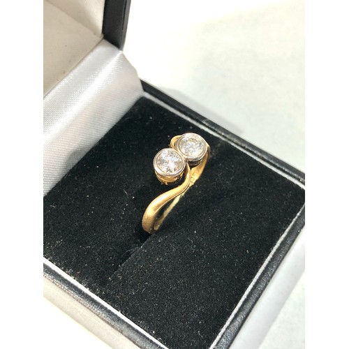 103 - Fine 18ct gold and diamond ring set with 2 diamonds est approx 0.90ct  weight of ring 3.2g