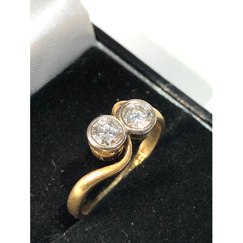 103 - Fine 18ct gold and diamond ring set with 2 diamonds est approx 0.90ct  weight of ring 3.2g