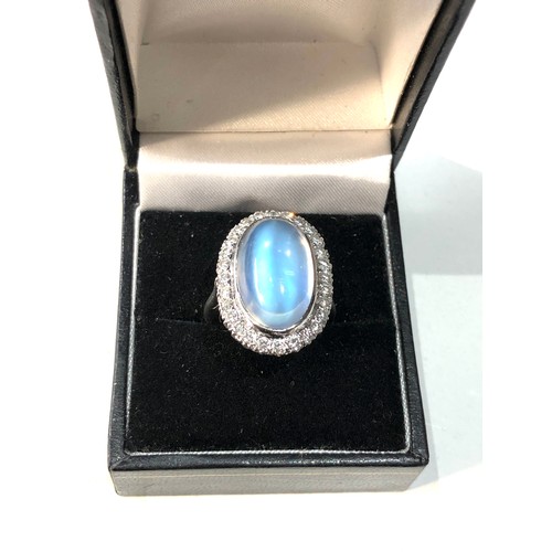 105 - Fine plat large moonstone and diamond halo ring central moonstone measures approx 18mm by 12mm with ... 