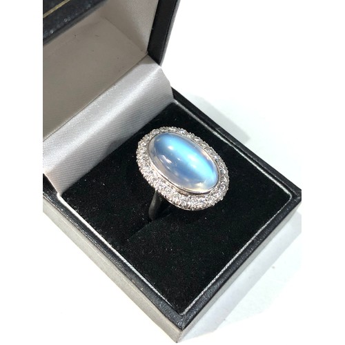 105 - Fine plat large moonstone and diamond halo ring central moonstone measures approx 18mm by 12mm with ... 