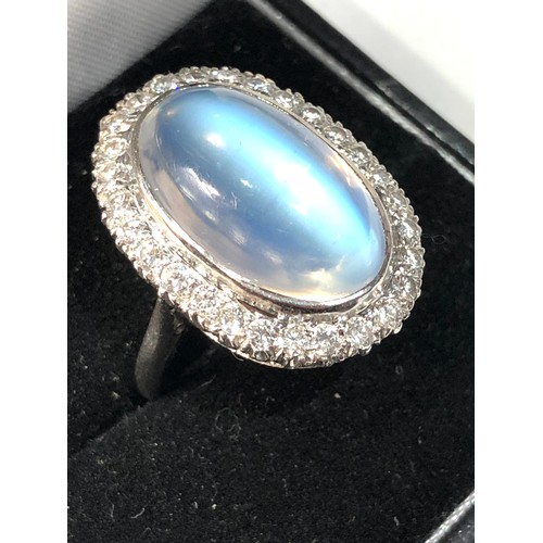 105 - Fine plat large moonstone and diamond halo ring central moonstone measures approx 18mm by 12mm with ... 