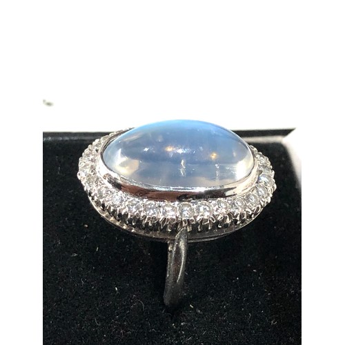 105 - Fine plat large moonstone and diamond halo ring central moonstone measures approx 18mm by 12mm with ... 