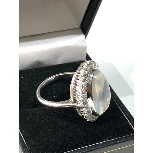 105 - Fine plat large moonstone and diamond halo ring central moonstone measures approx 18mm by 12mm with ... 