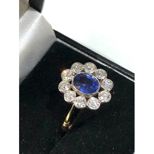 109 - Fine Platinum & 18ct gold  Sapphire & diamond halo ring set with central sapphire measures approx 7m... 