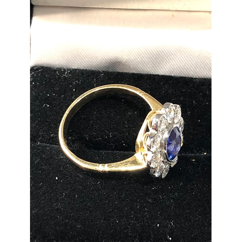 109 - Fine Platinum & 18ct gold  Sapphire & diamond halo ring set with central sapphire measures approx 7m... 