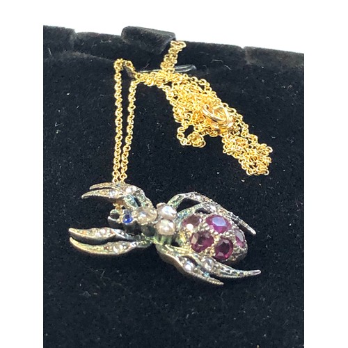 116 - Rose diamond and ruby spider pendant and chain gold back silver front with 18ct gold chain body set ... 