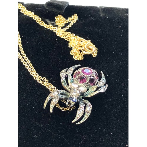 116 - Rose diamond and ruby spider pendant and chain gold back silver front with 18ct gold chain body set ... 