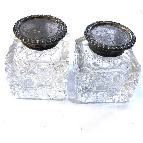 33 - Pair of antique silver top and cut glass ink bottles measure approx height 5.8cm bottle is approx 5c... 