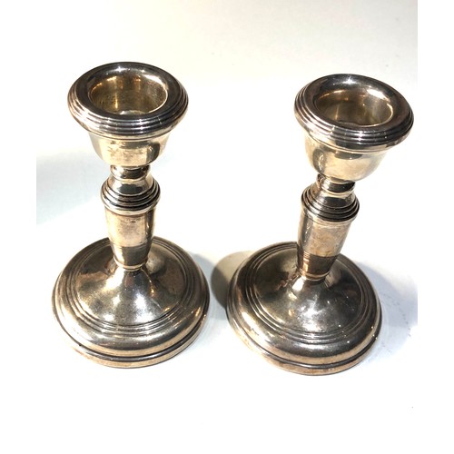 27 - Pair of vintage silver candle sticks measure approx 11cm Birmingham silver hallmarks filled bases