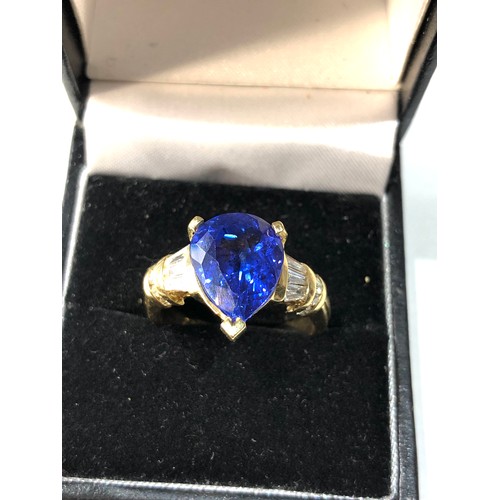 106 - Fine 18ct gold diamond and tanzanite  ring set with large central tanzanite measures approx 13mm by ... 