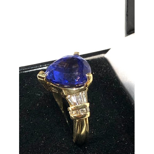 106 - Fine 18ct gold diamond and tanzanite  ring set with large central tanzanite measures approx 13mm by ... 